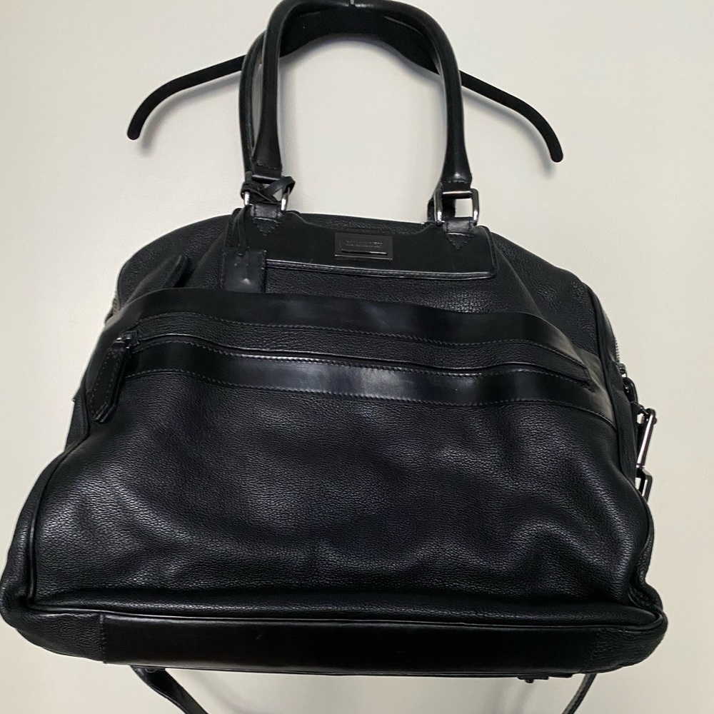 Burberry bag lightly worn missing a peg on the button but otherwise like new